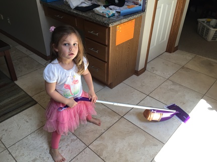 Greta helping mop